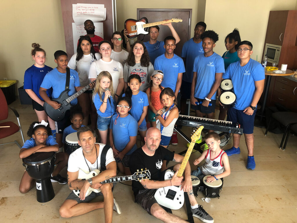 A Rock to Recovery youth music session with students on electric guitars